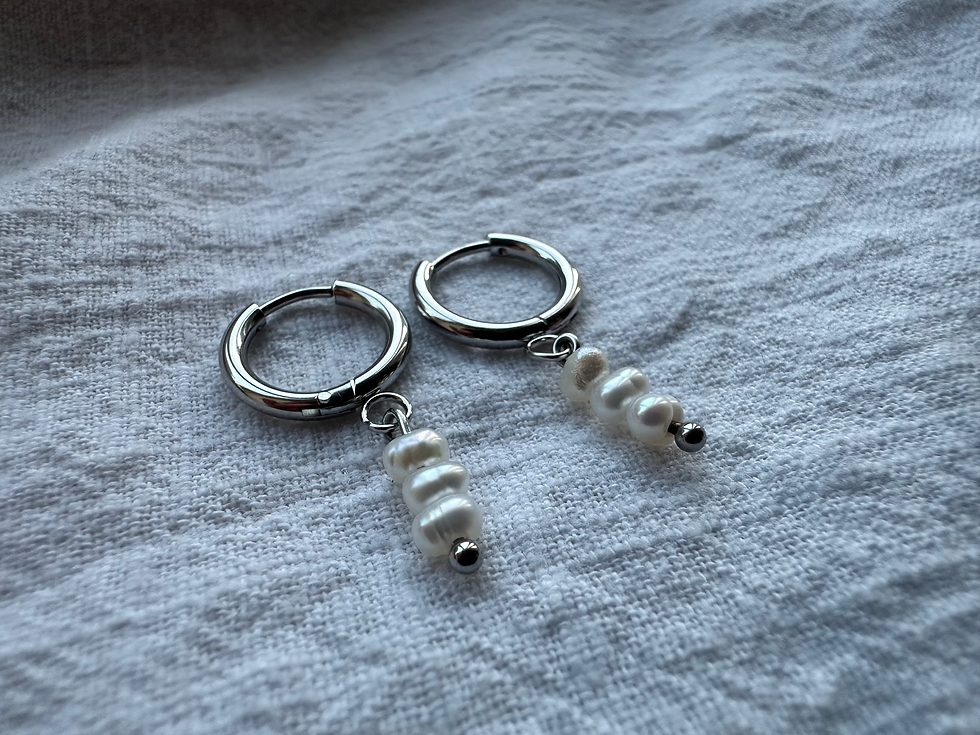 Thumbnail: Pearl Huggie hoop earrings
