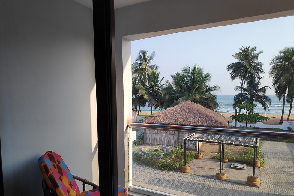 Ahoto Room at Afiki: Handcrafted queen bed with African-print decor, sea, garden and pool views