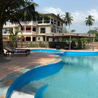 Afiki beach resort swimming pool and house