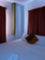 Akyedi 2 Room at Afiki: Ground floor room with handcrafted double bed with African-print decor and e