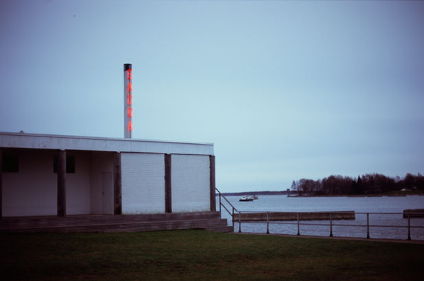 Analog photography picture of a sauna building next to the sea in Helsinki Finland