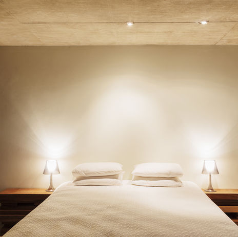King-size bed with bedside lamps