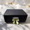 Thumbnail: Something Special Christmas Box by Melt My Heart, featuring an elegant gift box with a sage green bow, ceramic burner, soy wa