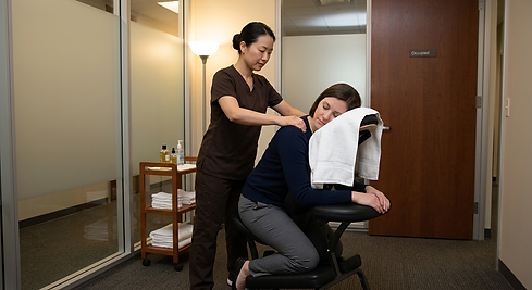 Firefly_Gemini Flash_corporate chair massage with an asian masseuse in all brown and ensur