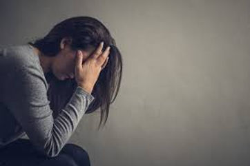 1 LAdy holding head.jpg