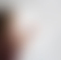 a little girl blows glitter into the air