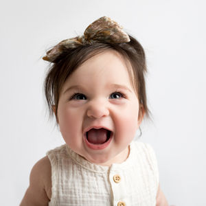 baby smiling at camera