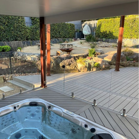 Trex Biscayne deck and spa with pergola; note the diagonal decking orientation — Bangor.