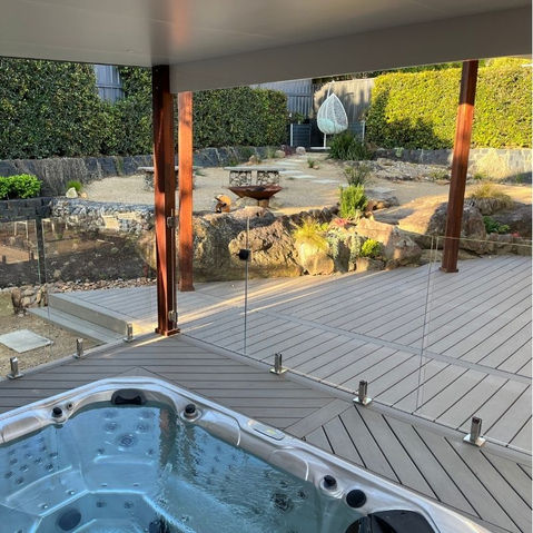 Trex Biscayne deck and spa with pergola; note the diagonal decking orientation — Bangor.