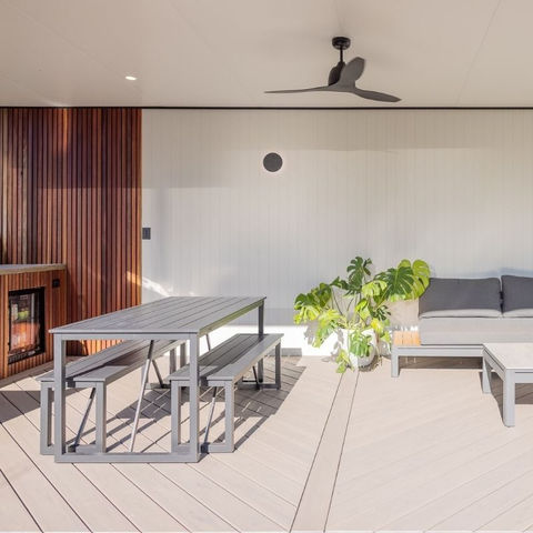 Contemporary pool cabana featuring Spotted Gum hardwood, James Hardie V-groove cladding, Trex Biscayne decking laid diagonally, and a Versiclad insulated pergola on aluminium beams. Includes a custom BBQ area with polished concrete bench and bar fridge.