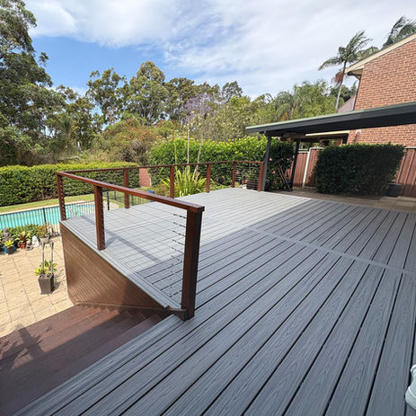 Trex® composite deck rebuild featuring Island Mist decking, timber posts and stainless steel wire balustrading. A low-maintenance outdoor renovation designed for lasting performance and modern street appeal.