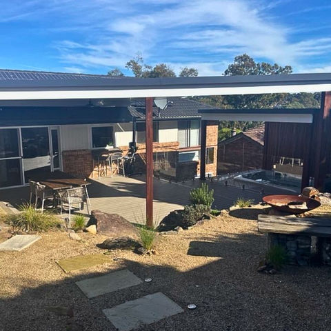 Trex Biscayne deck with 2 x Versiclad insulated pergolas, aluminium beams and Merbau posts, outdoor kitchen and separate spa area including glass balustrade fencing — Bangor.