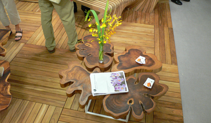 Table with flowers and brochures. Diamond Tropical Hardwoods.