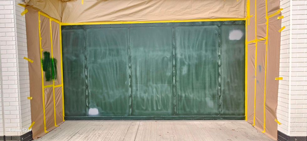 Green commercial doors masked and prepared before professional respraying