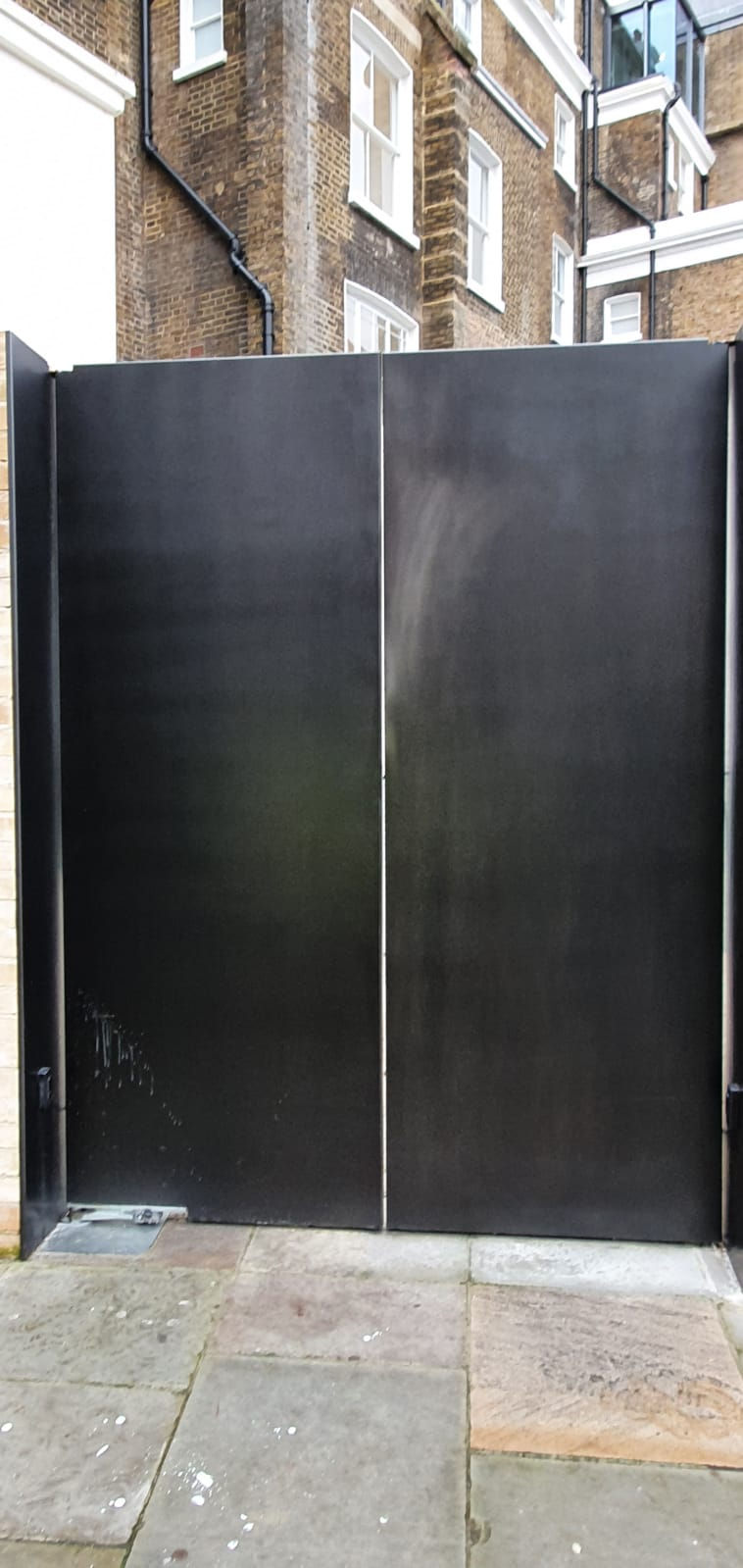 Anodised-effect commercial double doors before professional respraying