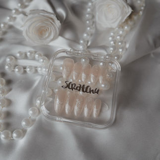 Almond shaped nails with pearl french and floral details for brides
