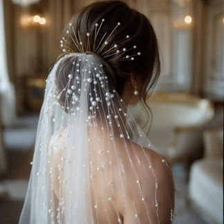 Long bridal veil with scattered pearl embellishments on soft tulle