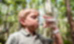 A child drinking water at Florida Everglades