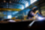 Interior view of Quality Services Ltd 280,000 ft² steel fabrication facility with overhead crane