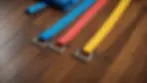 Close-up view of resistance band on a wooden gym floor