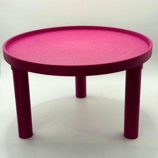 A 3D printed bright red round hamster platform