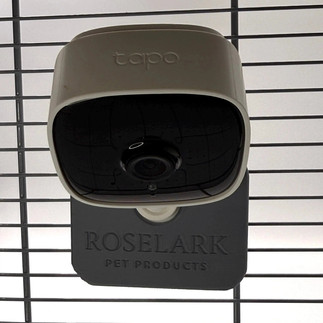 A 3D printed camera mount holding a square camera on to metal bars