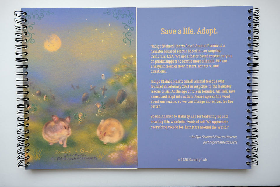 Spiral-bound journal featuring an illustration of two hamsters in a moonlit graveyard, painted in soft blue, green, and gold tones.