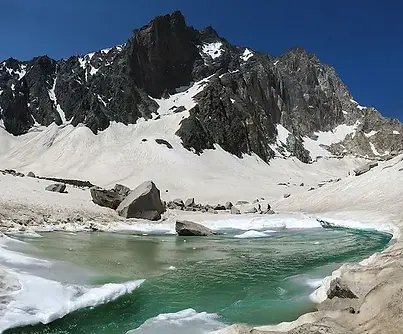Glacial_lake_in_Alam_Kuh.jpg.webp