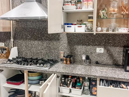 Organized modern kitchen with clear counters and functional storage.