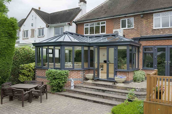 Stormclad-p-shaped-conservatory-black-min-1200x798-1.jpg