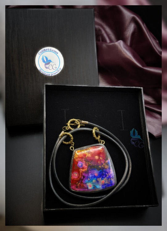 Thumbnail: Buy Necklace "Galaxy". The pendant is made from polymer clay, hand painted and has a resin covering layer that adds safety to