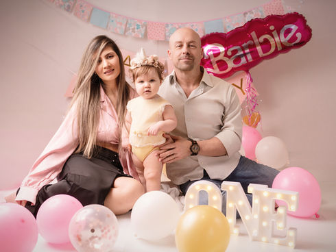 a mom and dad celebrating the first year of their baby
