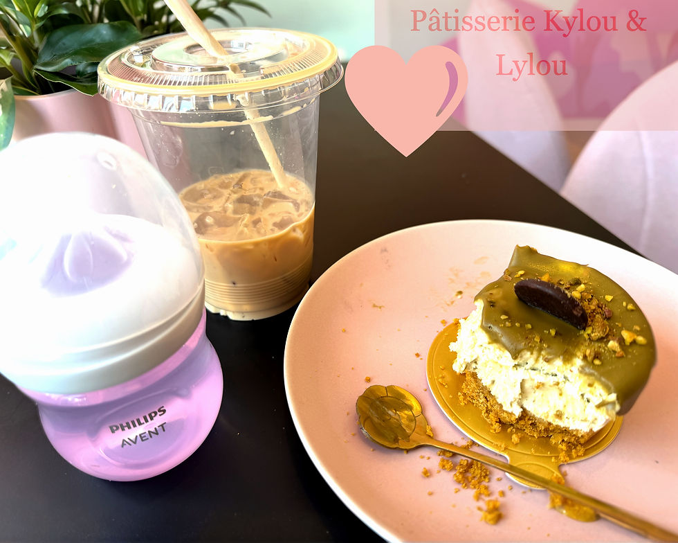 Iced coffee, baby bottle, and half-eaten pistachio cake on a pink plate sit on a table. Text reads "Pâtisserie Kylou & Lylou."