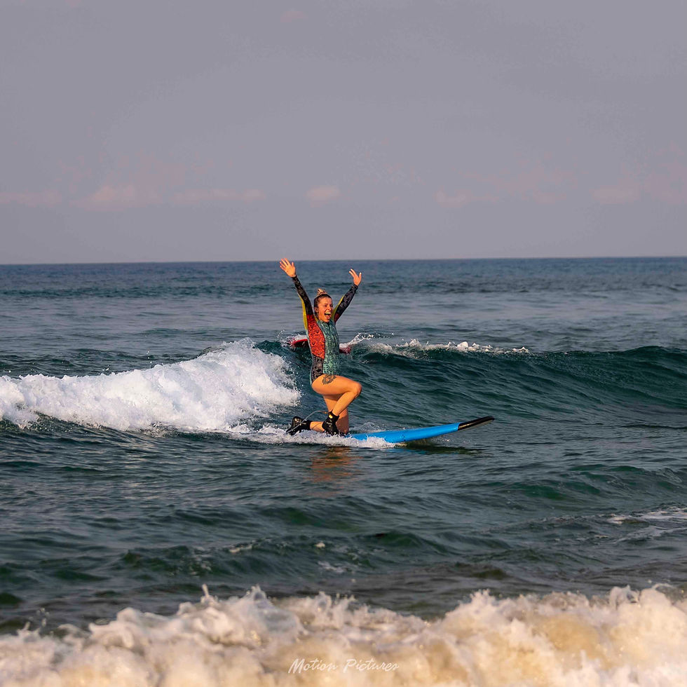 Surfer celebrating on a wave, things to do in Cabarete.