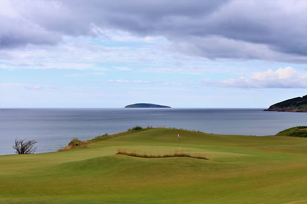 18th green cliffs blue clouds.jpg