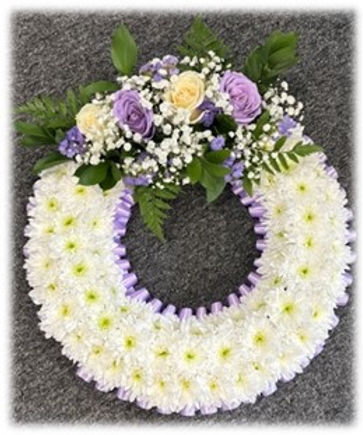 embedded floral wreath funeral tribute