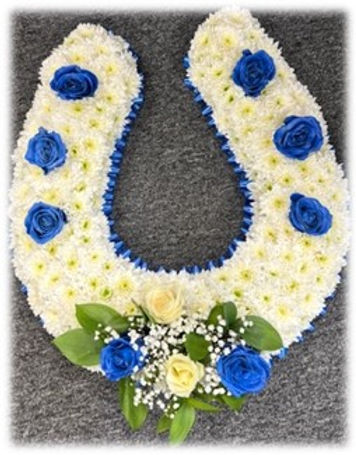 embedded floral horse shoe funeral tribute