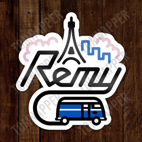 A simplified logo of Remy the campervan. A little blue van driving in front of the Eiffel Tower