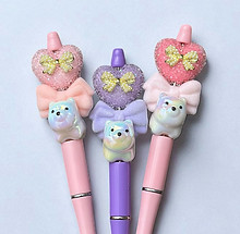 Themed beadable pens with pastel bows, teddy bears, and kawaii giftable designs by Jadey Jane Studio.