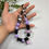 Thumbnail: Kuromi pastel purple & black phone chain wristlet bag charm