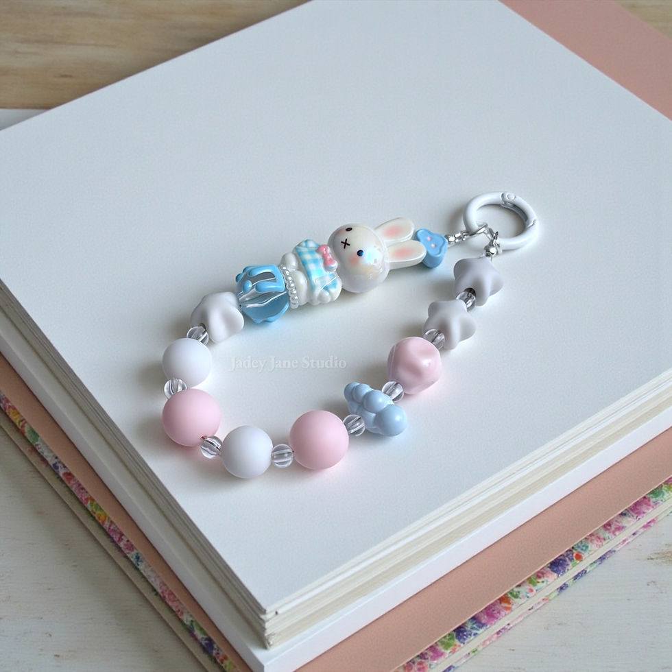 Pastel Miffy phone strap with 3D bunny charm and soft pink, blue, and white beads by Jadey Jane Studio