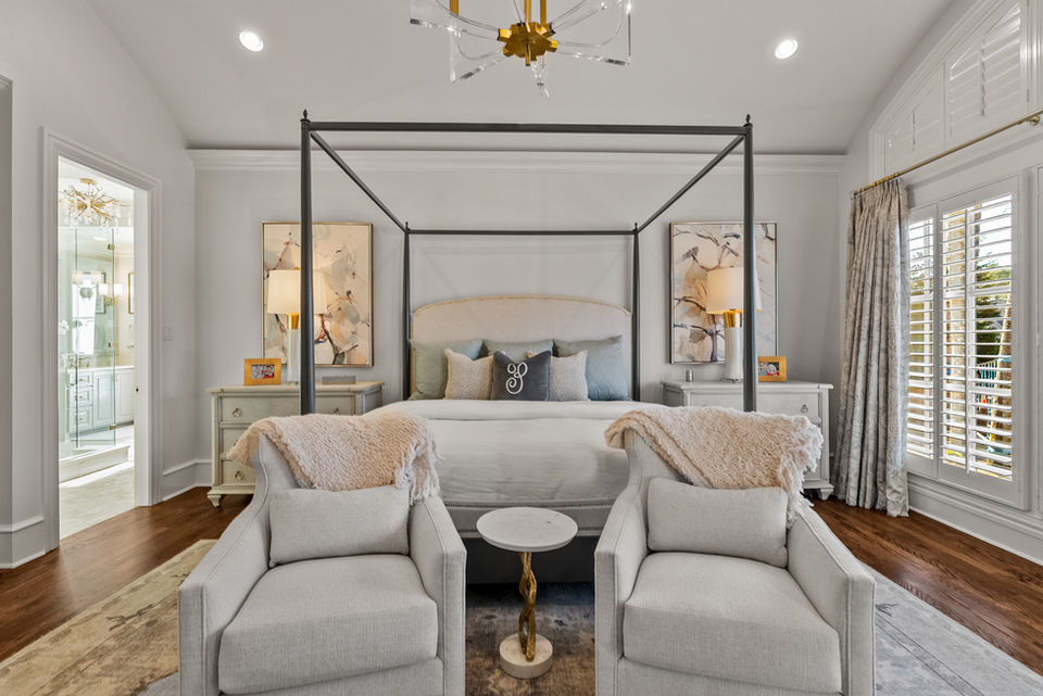 Primary Bedroom designed with light colors and peaceful sitting area