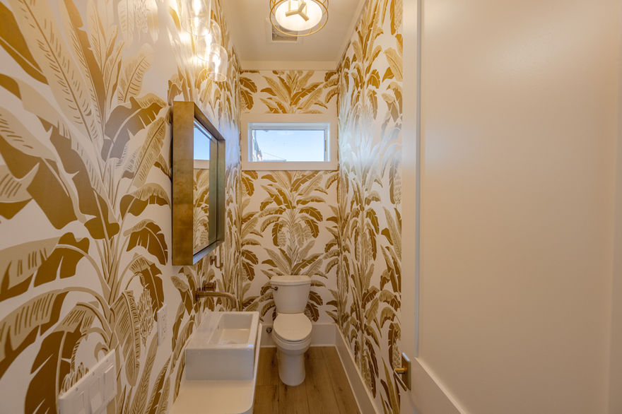 Modern Powder Bath with Gold Banana Leaf Wallpaper