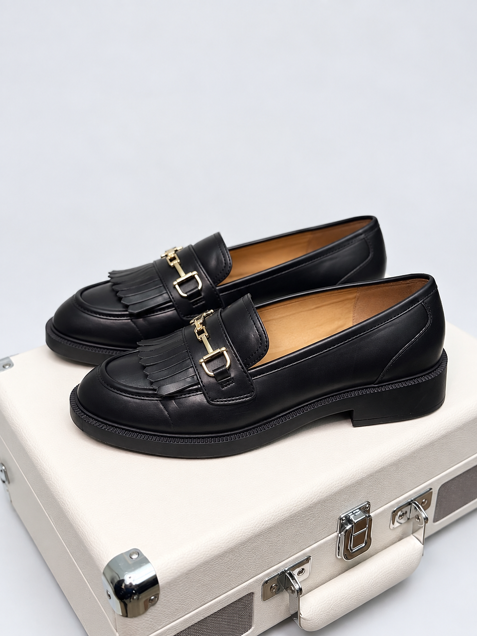 Unisa black leather fringe horsebit loafers side view
