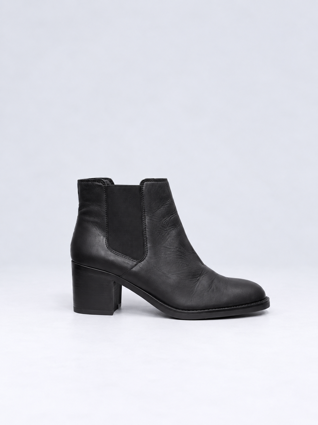 Clarks black leather Chelsea ankle boots side view