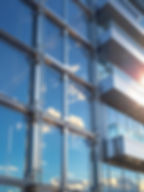 Ultra-realistic exterior view of a modern aluminium profile spider glazing system on a com