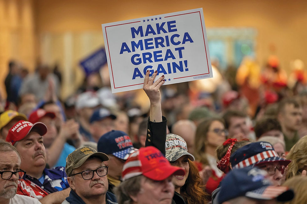 A supporter holds a Make America Great Again sign at a political rally. Photo: AP/Mike Roemer via The Salt Lake Tribune.