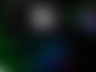 Desktop computer, monitor and keyboard illuminated with colored lights