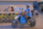 Wang Jibing on the road during his work as a food delivery rider.