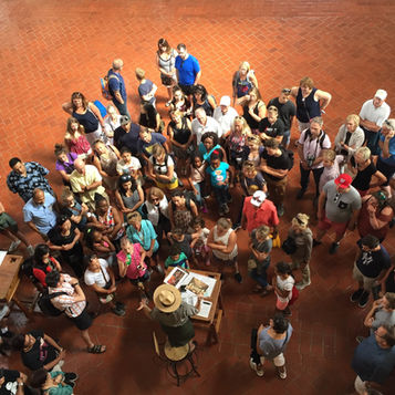 Visitors gather in the Great Hall at the Ellis Island Immigration Museum.